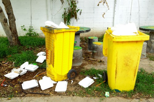 Team members performing garden cleanup